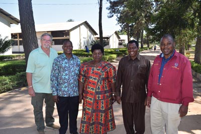 Image shows Bill Crouch with four members of Mwanza Regional Vocational and Service Centre