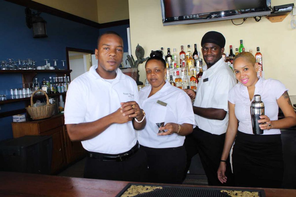 An image of four food and beverage servers in the Caribbean.