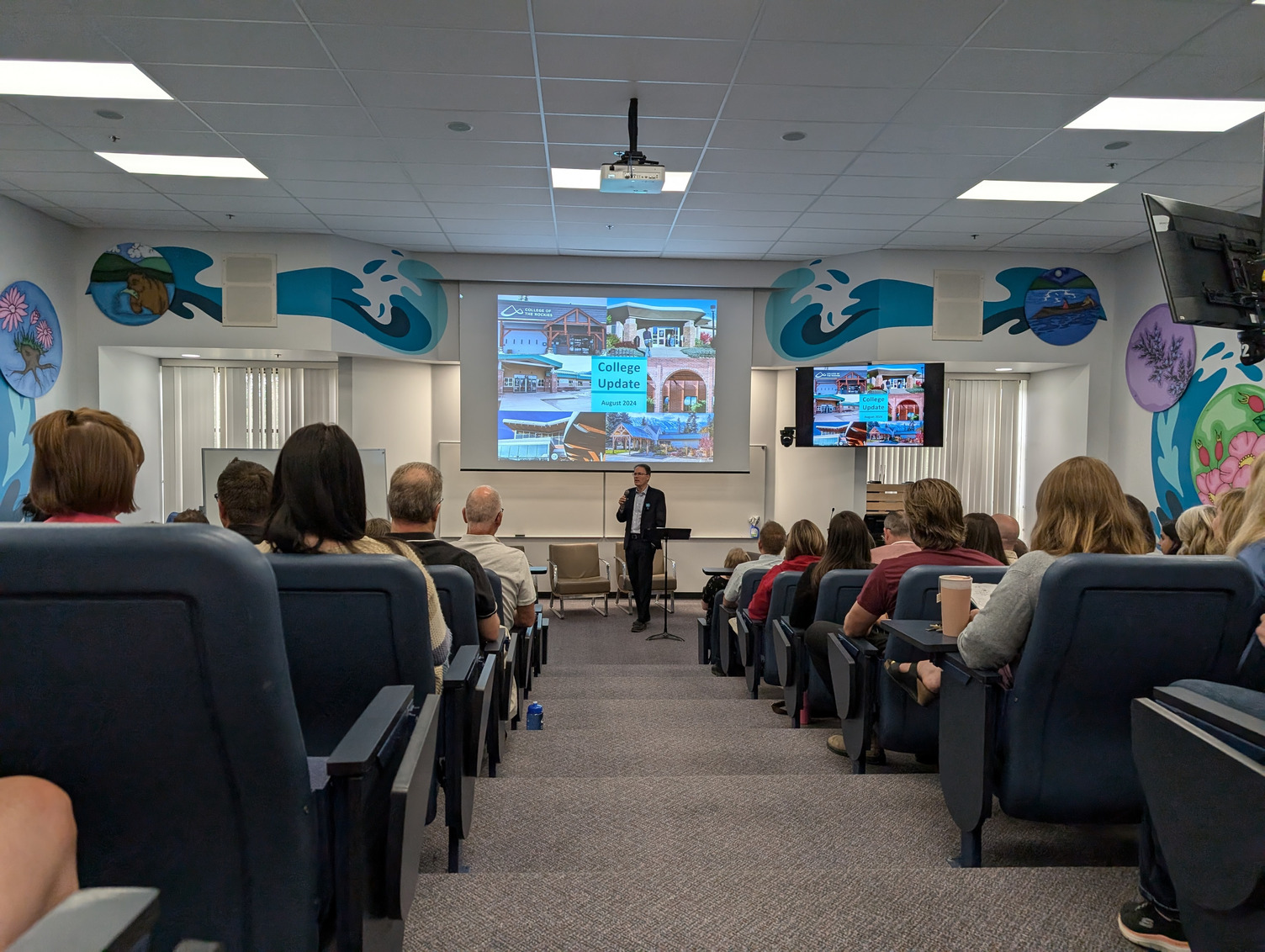 College President speaking to large group of employees at annual kick-off event.