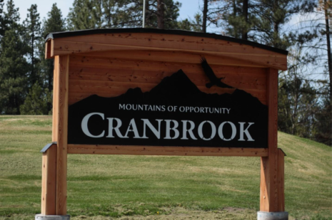 Image of a sign which reads Mountains of Opportunity. Cranbrook.