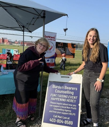 Image shows two women at an outdoor event