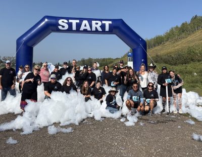 Image showed group of runners under an inflatable start arch, in a pool of bubbles.