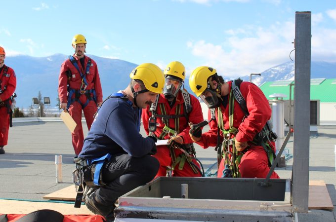 Fire Training Certificate students examining roof entryway.