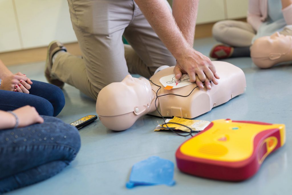 An image showing a person practicing CPR.