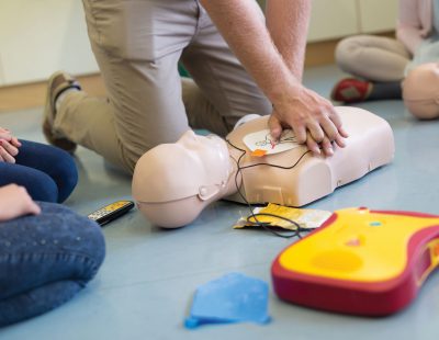 An image showing a person practicing CPR.