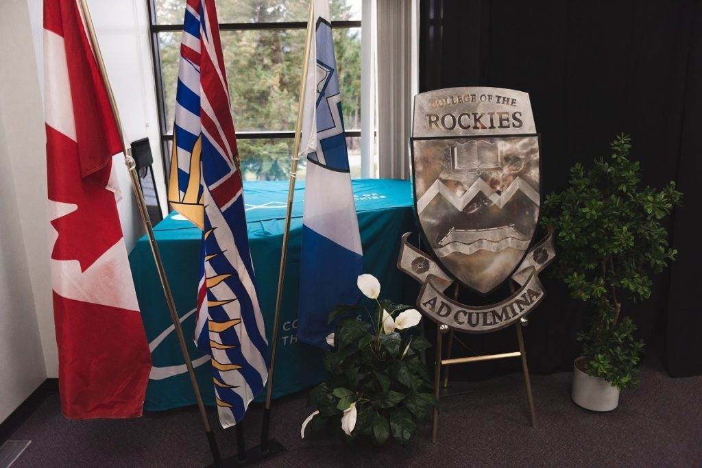 Flags of Canada, British Columbia, and College of the Rockies in addition to the College crest.
