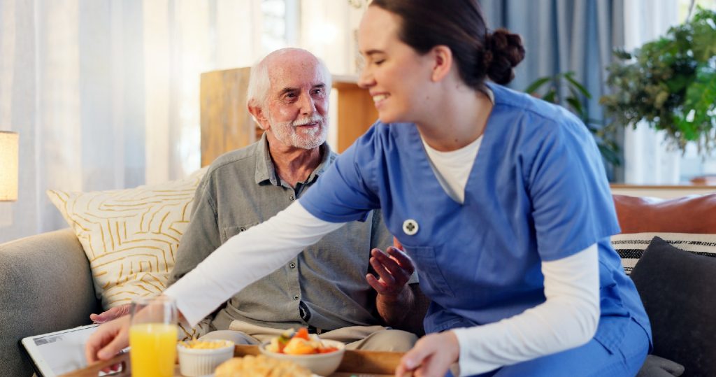 senior man in nursing home for elderly care, nutrition and support. Retired male person, caregiver and service for hungry patient in assisted living, healthcare and wellness