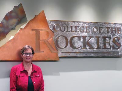 Image of Heather Hepworth standing in front of a College of the Rockies sign.
