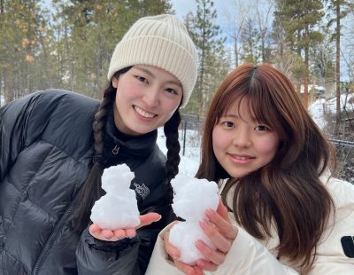 Students showing off miniature snowmen.