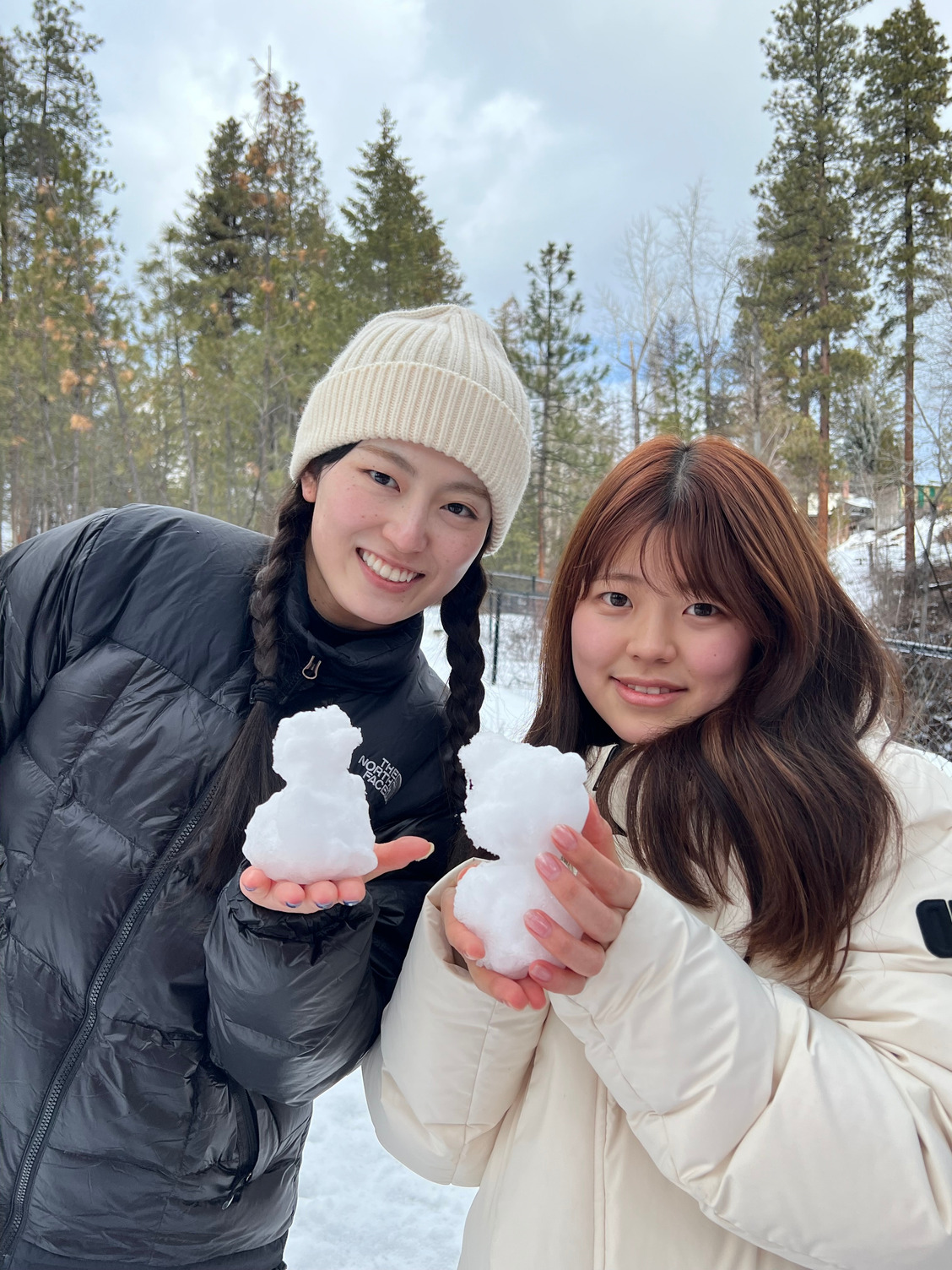 Students showing off miniature snowmen.