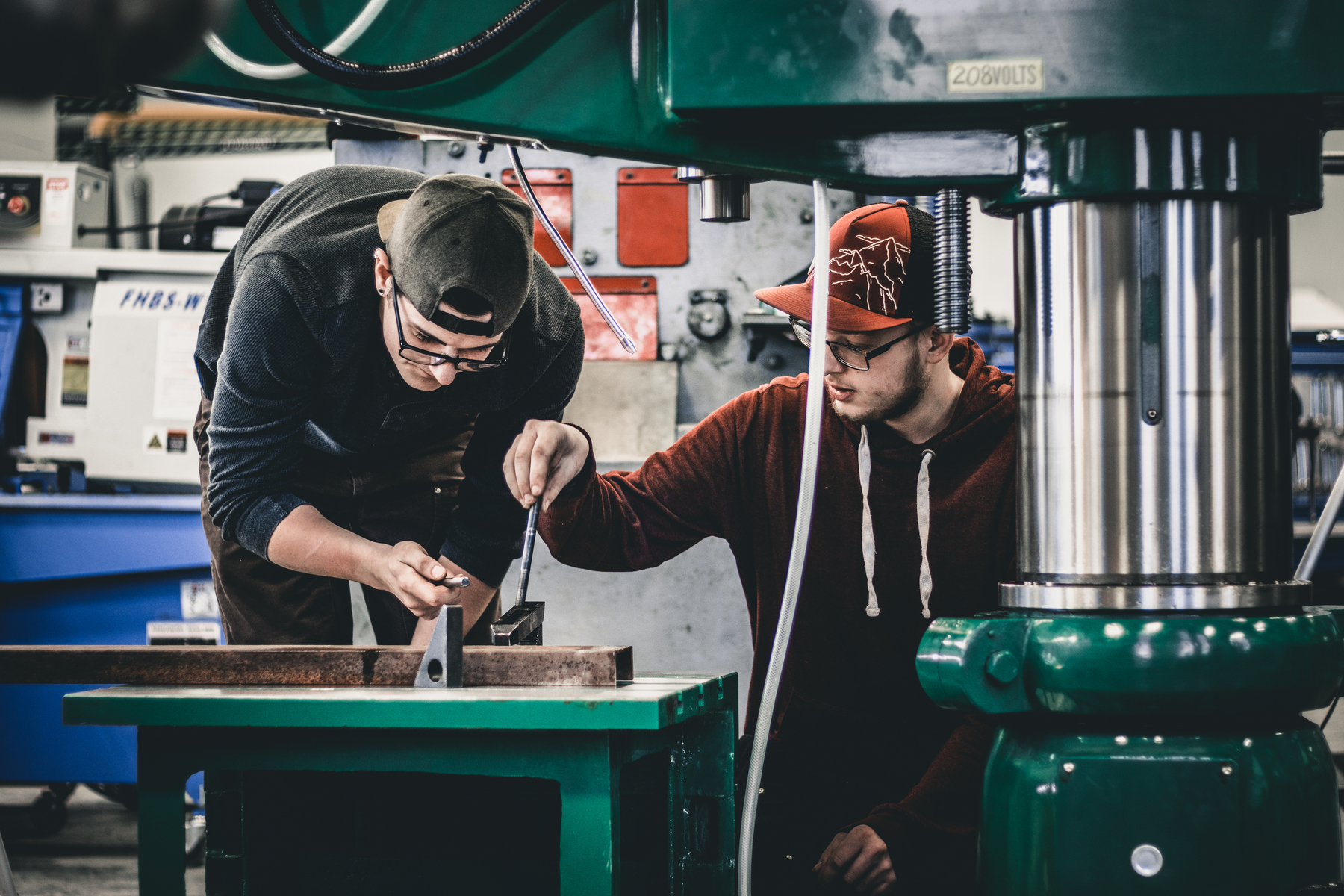 Industrial Mechanic students working on piece of equipment