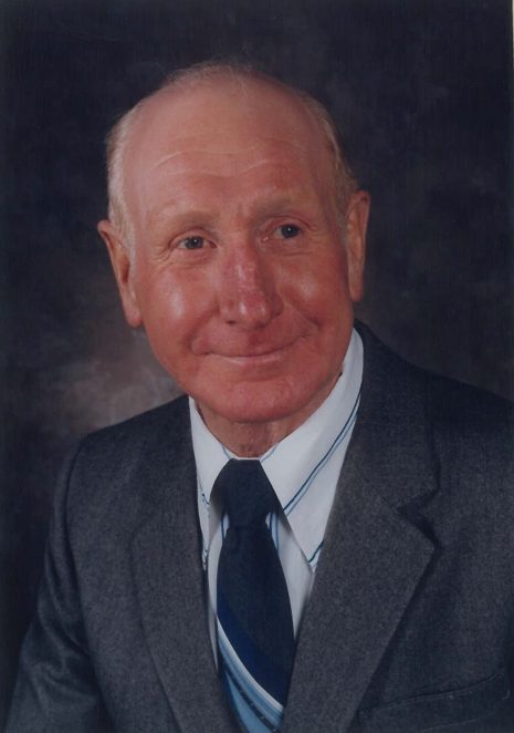 Image of kind looking man looking toward the camera with a slight smile.