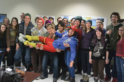 Image of Jamie McDonald with a group of Adventure Tourism Business Operations students, four of whom are holding him up sideways.