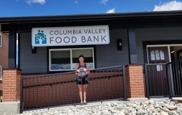 Image shows Invermere campus manager Michelle Taylor outside the Invermere Food Bank.