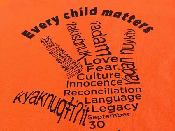 Image depicts Orange Shirt Day t-shirt logo.