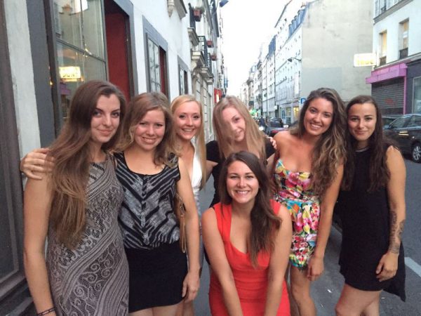 Image shows a group of seven young women in Paris.