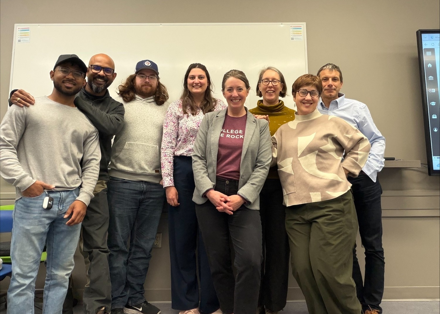 Image shows group of students and pitch competition judges.