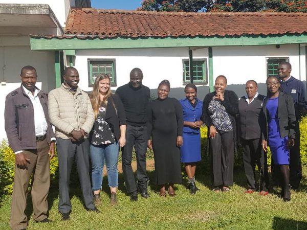 Image shows group of 10 people in Kenya.