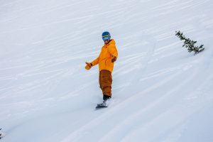 Image shows man snowboarding at Fernie Alpine Resort