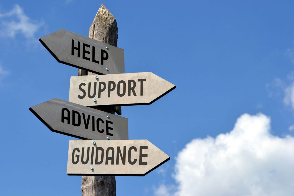 an image of a sign with markers pointing to help, support, guidance and advice.