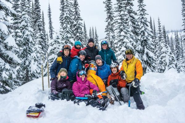Image of a group of students along with CMH representative on a snowy mountain.