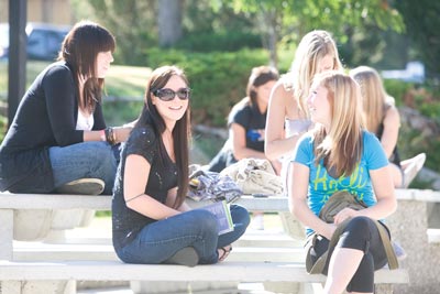 An image of female students outside in the sunshine.