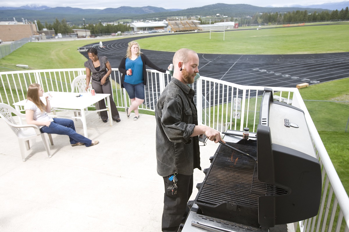 An image of a BBQ taking place on the balcony at Student Housing.