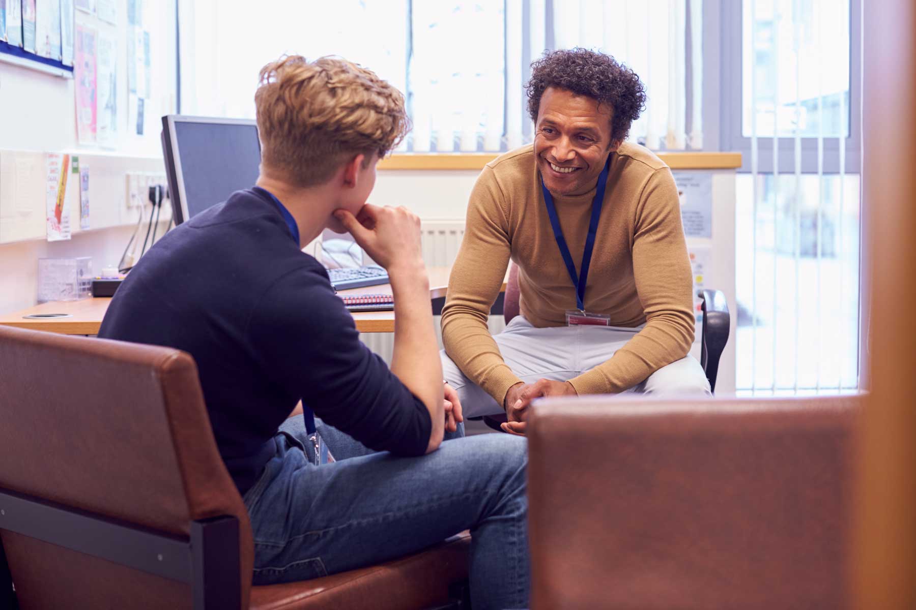 An image of an education advisor speaking with a student.